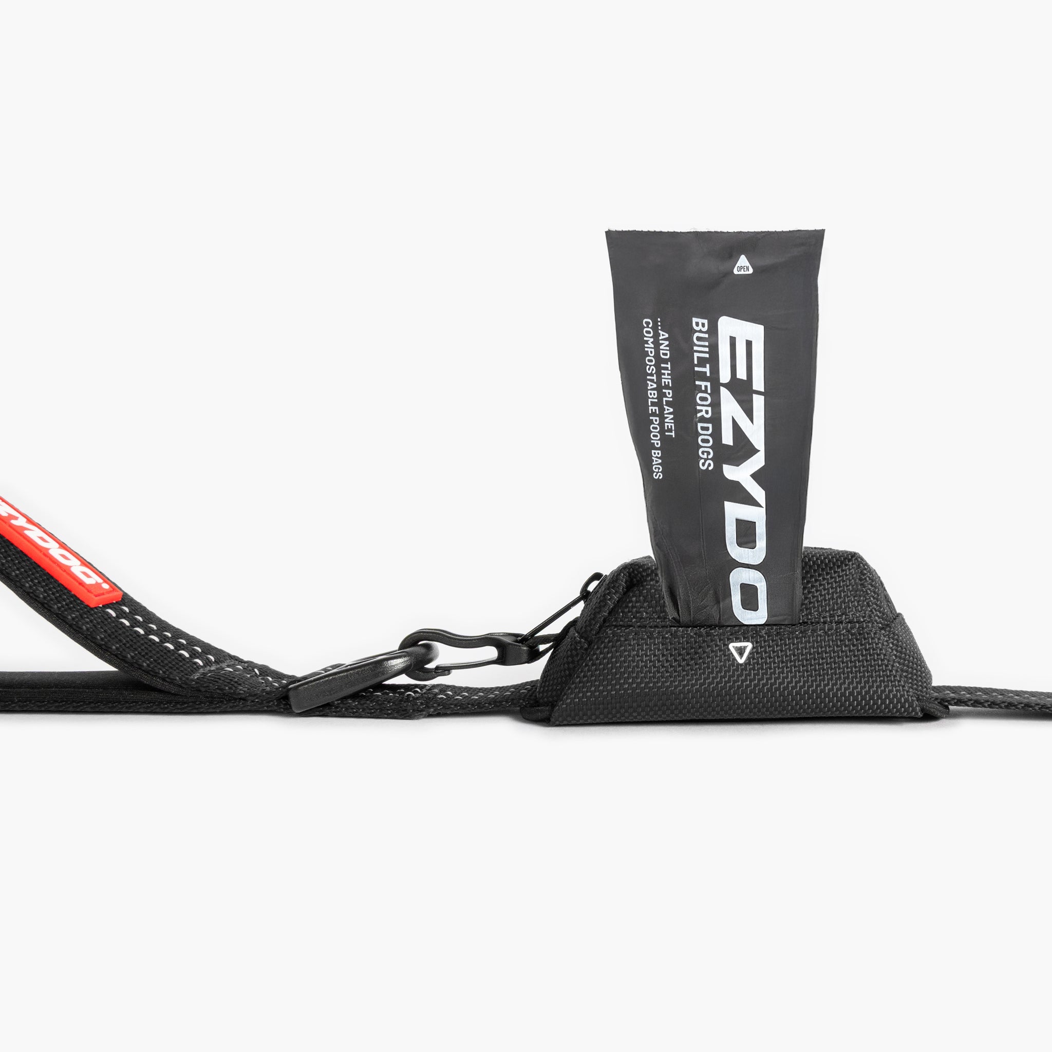 Black Essential Dog Poop Bag Holder with a red strap and EZYDOG branded pouch on a white background
