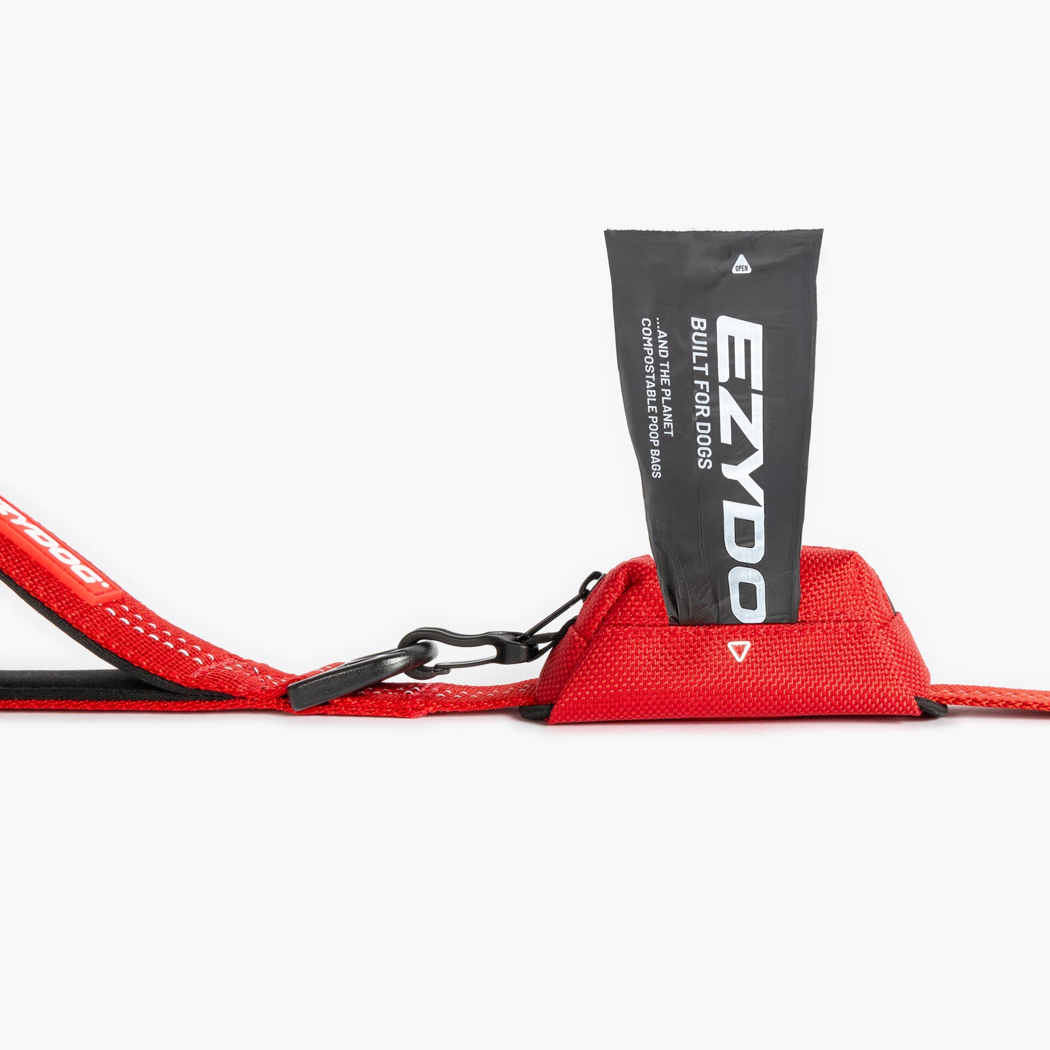Red Essential Dog Poop Bag Holder with a black pouch labeled 'EZYDOG'
