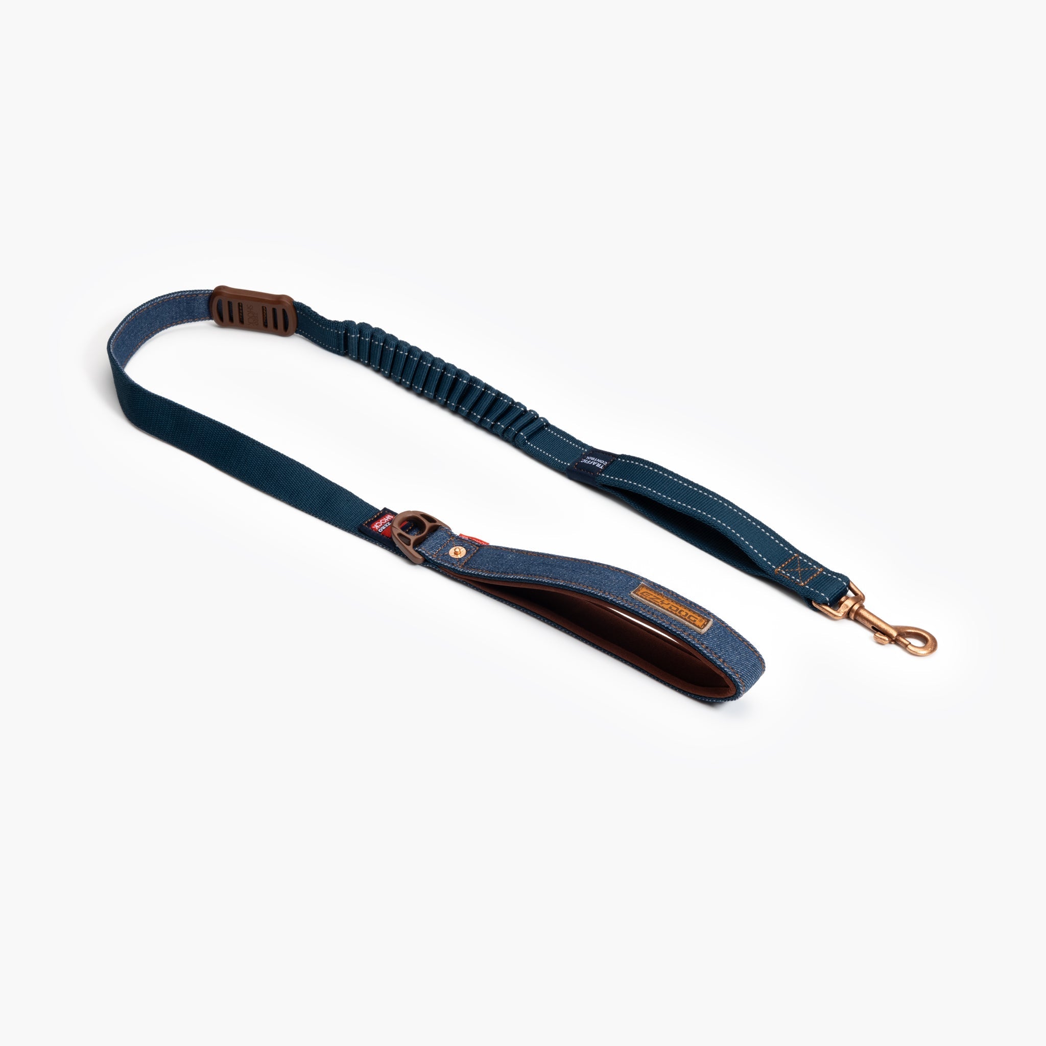 A denim blue dog leash with a shock absorption system in the middle, featuring a brown neoprene handle and metal clasp.